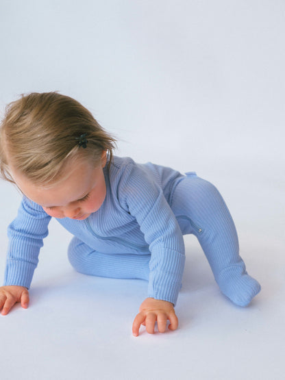 DreamBuy's premium powder blue sleepsuit, offering a soft touch and stylish look for babies, an ideal gift for newborns.