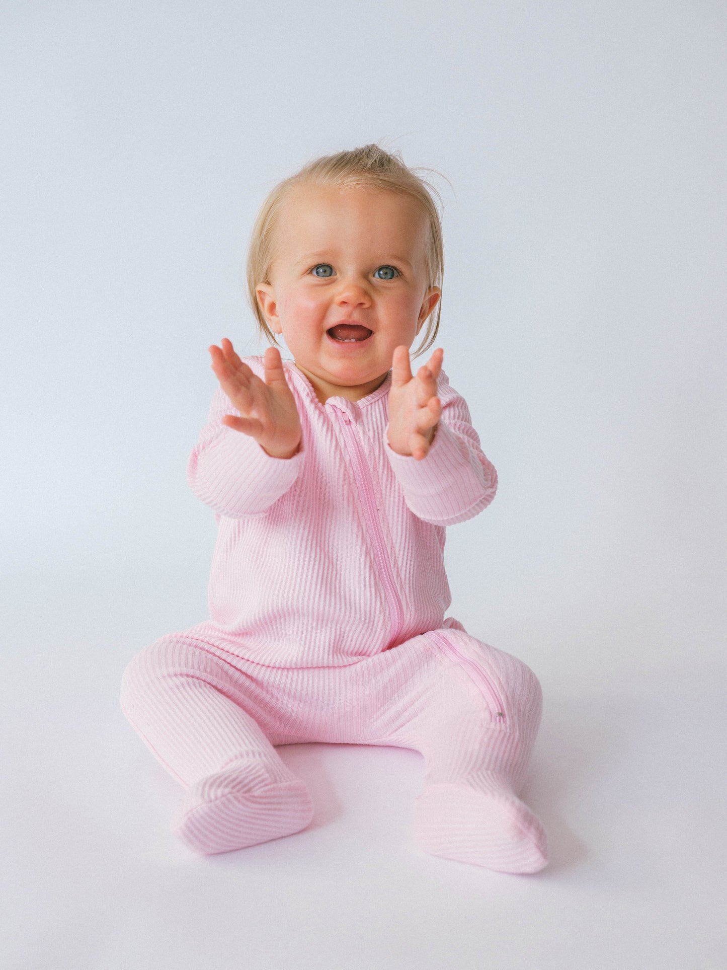 DreamBuy Sweet Pink Zip Sleepsuit for Babies, showcasing luxurious soft ribbed cotton, designed for comfort and style.