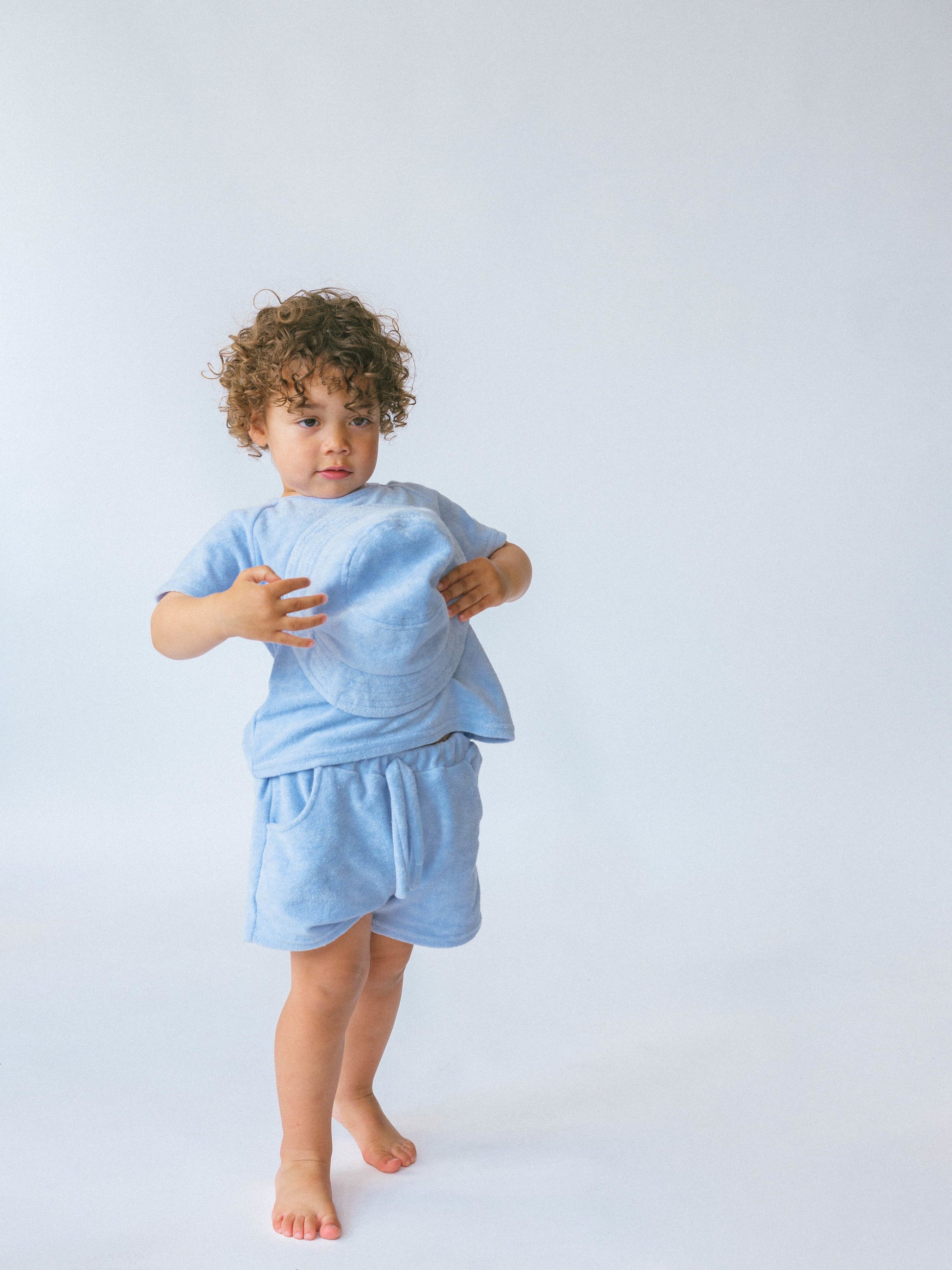 Luxury 3-piece coastal blue towelling set for kids by DreamBuy, featuring a personalized T-shirt, shorts, and bucket hat, perfect for summer adventures.