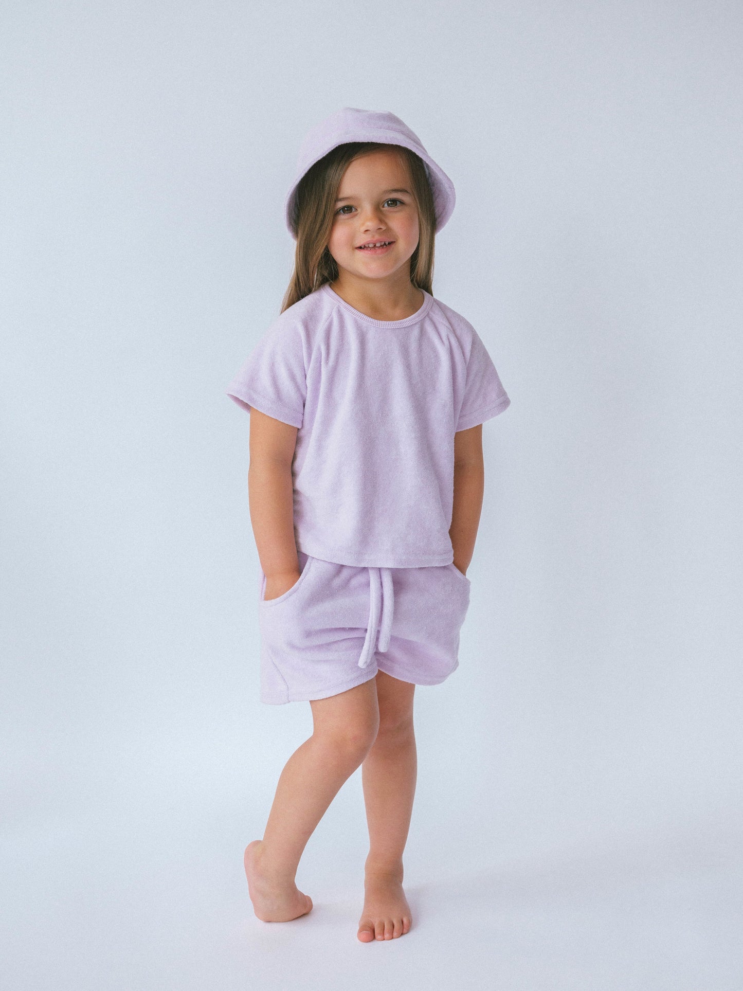 Luxurious personalised 3-piece lavender towelling summer set for kids by DreamBuy, featuring a stylish top, shorts, and a matching bucket hat.