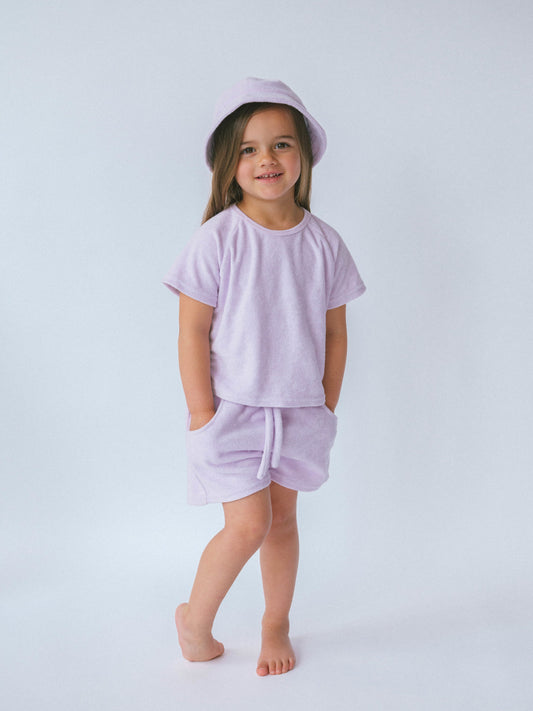 Luxurious personalised 3-piece lavender towelling summer set for kids by DreamBuy, featuring a stylish top, shorts, and a matching bucket hat.