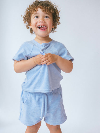 Luxury 3-piece coastal blue towelling set for kids from DreamBuy, showcasing super soft cotton fabric, perfect for summer adventures.