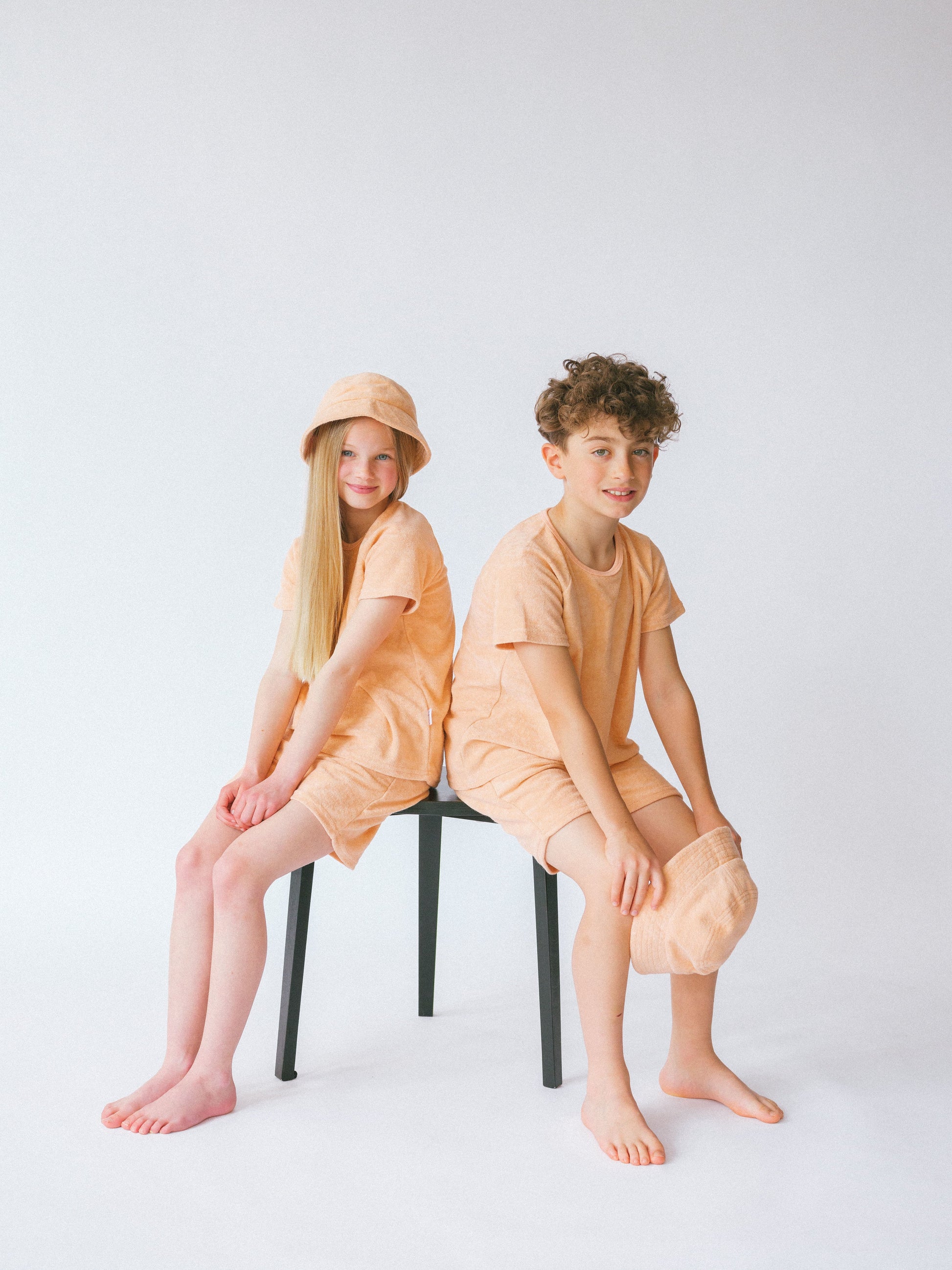Elegant sunset-coloured towelling cotton beach set for kids by DreamBuy, ideal for summer adventures and matching sibling outfits.