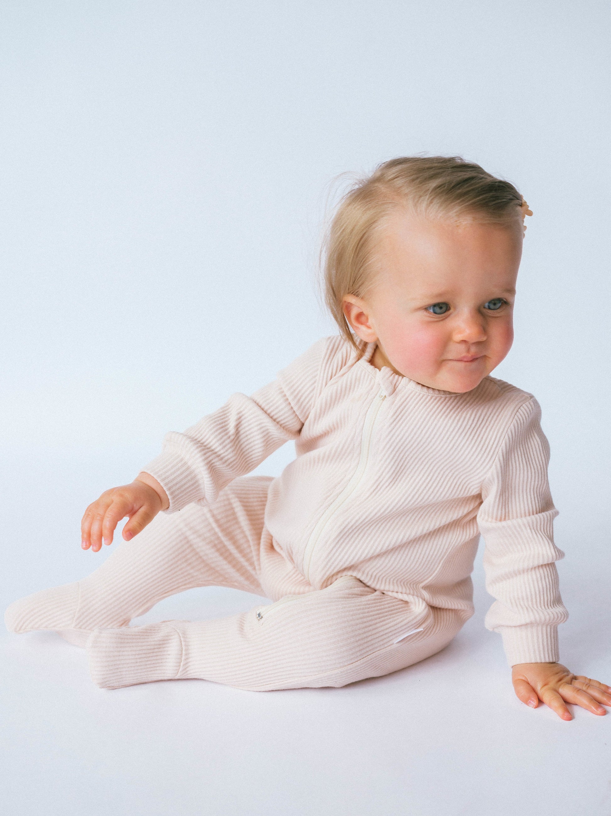 DreamBuy luxury zip sleepsuit for babies, crafted from soft ribbed cotton, perfect for ultimate comfort and skin-friendliness.