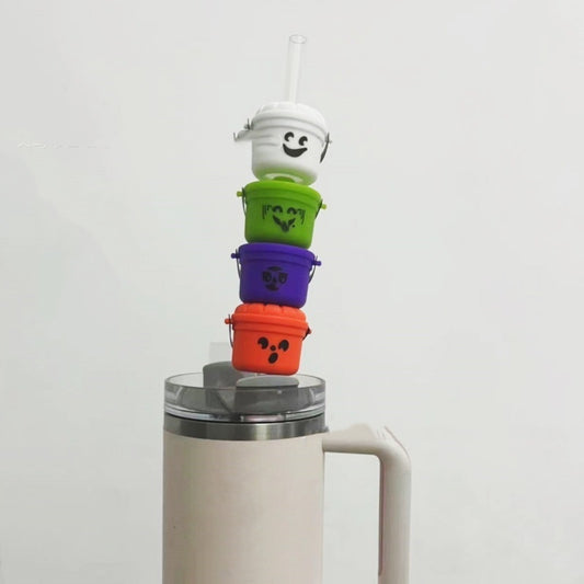Elegant Halloween Pumpkin Bucket Straw Mouthpiece Decoration Props exquisitely stacked in playful colours including white, green, purple, and orange, showcasing whimsical designs for an elevated Halloween experience.