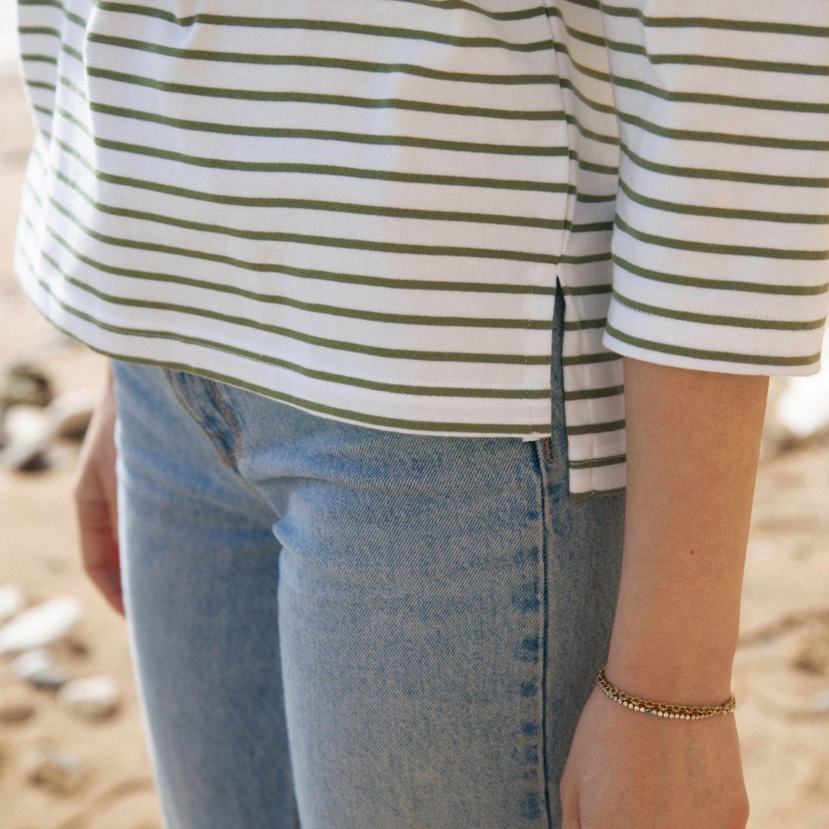 Elegant eco-friendly striped boat neck top, made from organic cotton, ideal for stylish women.