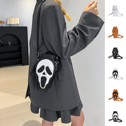 Elegant Halloween Coffin-shape Shoulder Bag featuring a gothic ghost and spider web design, showcased on a stylish model dressed in a chic grey blazer.