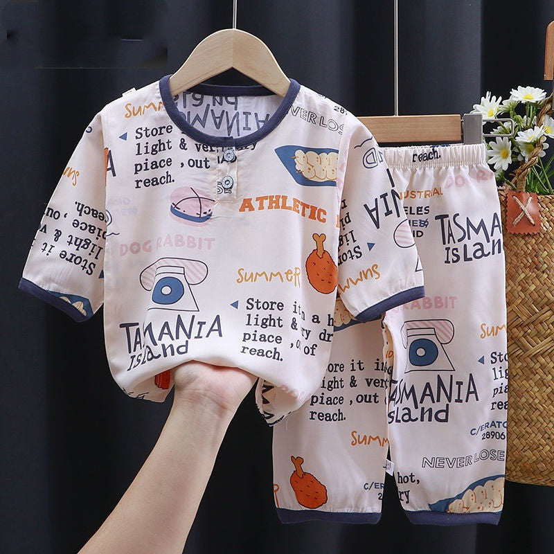 Luxurious summer clothes for babies featuring a cotton silk blend. The ensemble showcases a charming printed shirt and shorts set, perfect for warm weather, designed by Dazzling Dreams Studio.