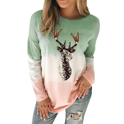 Chic women's reindeer sweater in green gradient, embellished with sequins, showcasing a contemporary style ideal for festive occasions.