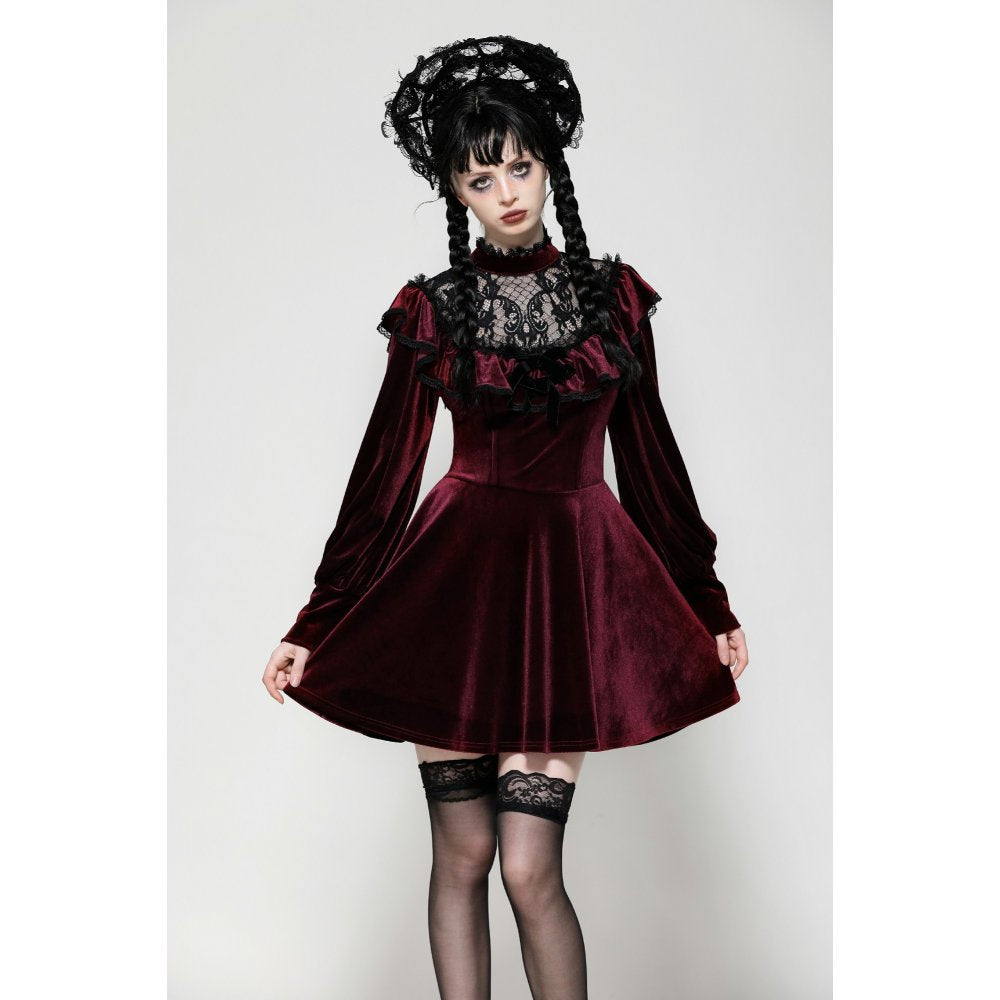 Close-up view of the delicate black gothic lace embellishments on the sleeves and neckline of the sumptuous burgundy velvet dress.