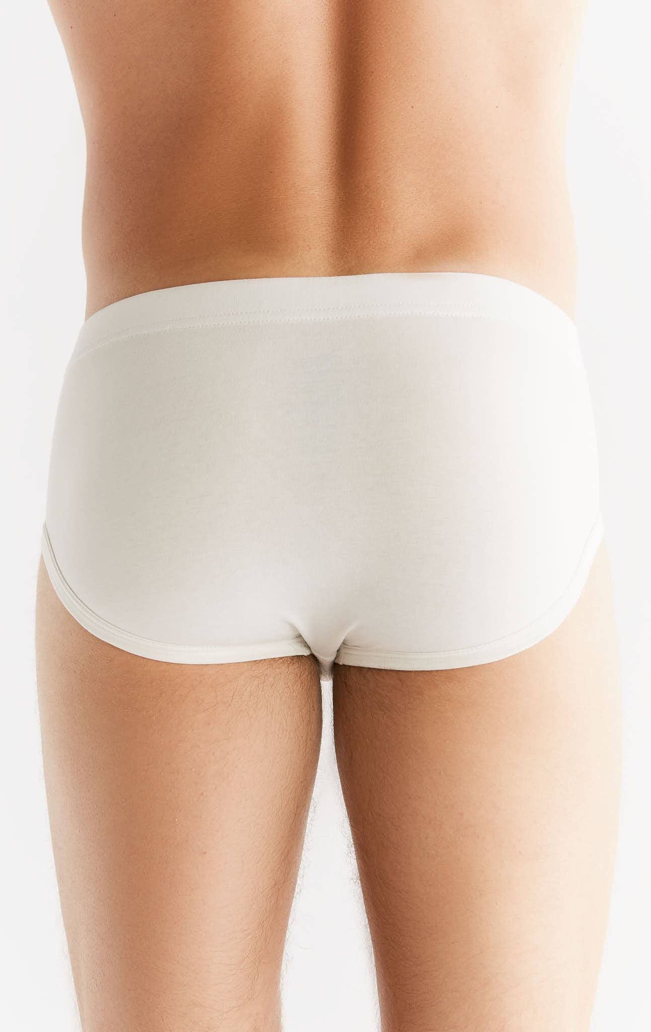 Detailed view of the sewn-in elastic waistband on luxury men's organic cotton briefs, representing eco-conscious comfort.