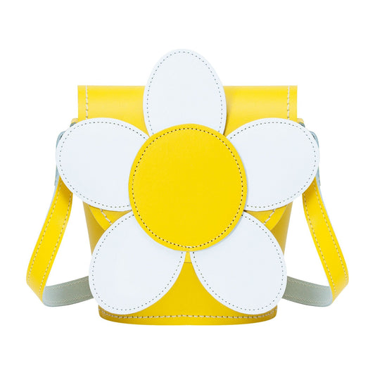 Luxurious Pastel Yellow Handmade Leather Daisy Barrel Bag featuring a unique floral design, showcasing intricate daisy appliqué, ideal for stylish occasions and crafted with premium materials. Adjustable strap adds versatility.