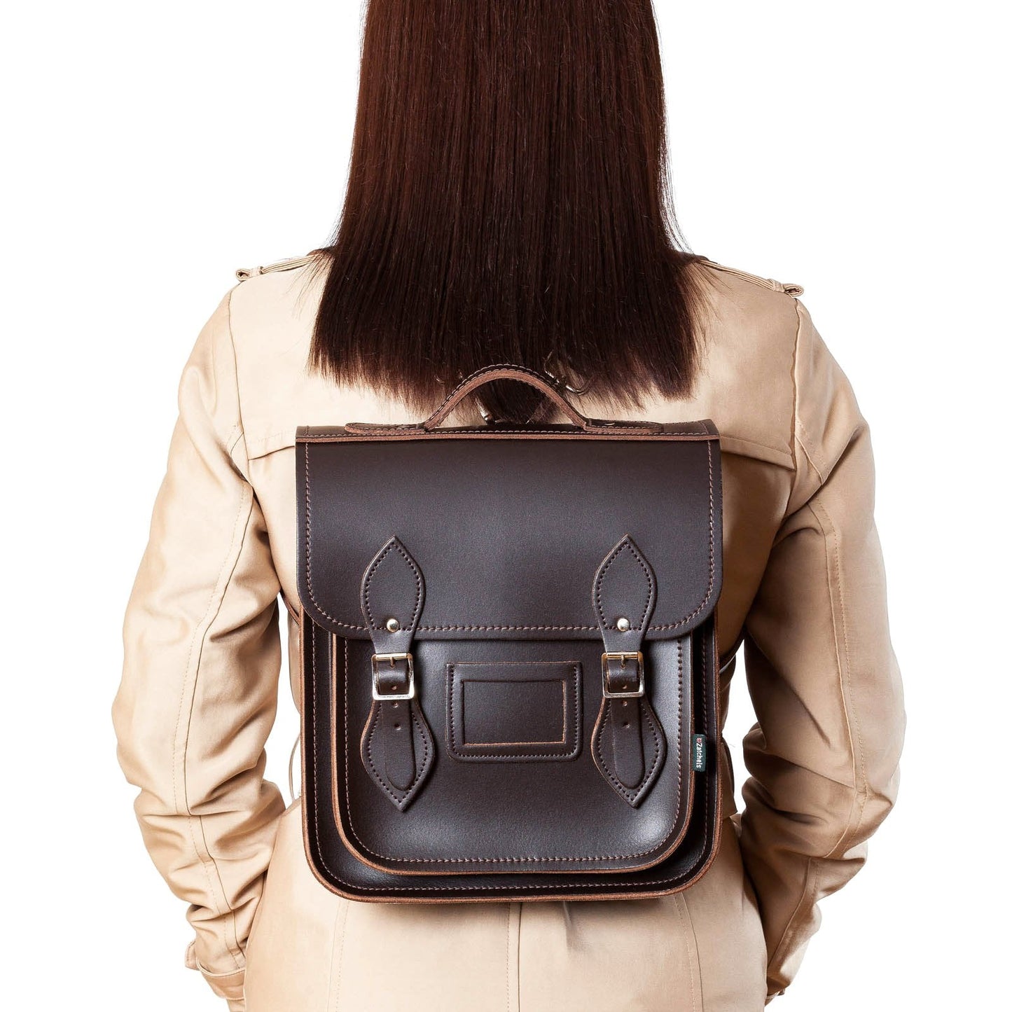 Versatile handmade dark brown leather city backpack available in two sizes, elegantly accommodating tablets and laptops up to 13 inches, perfect for urban professionals.