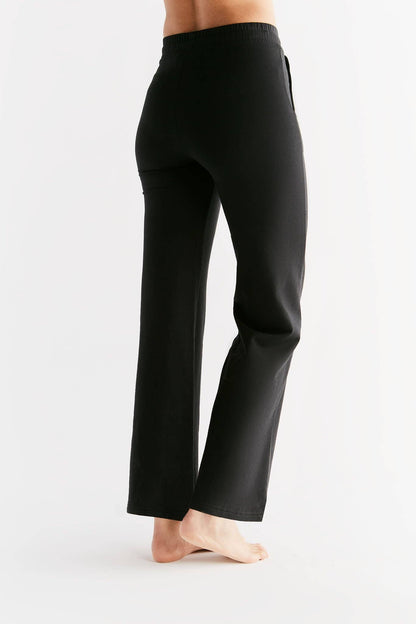 Close-up view of the organic cotton blend fabric of luxury women's sweatpants, highlighting sustainability and comfort.
