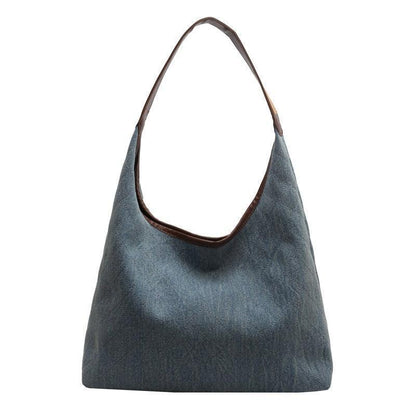 Luxury denim large shoulder handbag showcasing a stylish design suitable for both casual and business occasions, crafted from high-quality denim for a chic and versatile look.