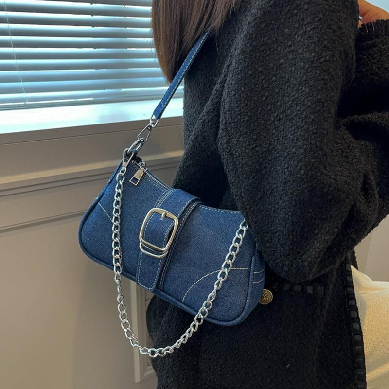 Versatile denim shoulder bag in a chic setting, demonstrating its practicality for casual outings and travel scenarios.