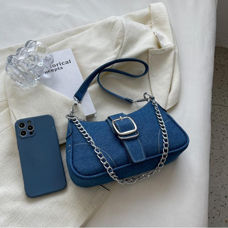 Chic crossbody small handbag in denim, designed for fashionable women on-the-go.
