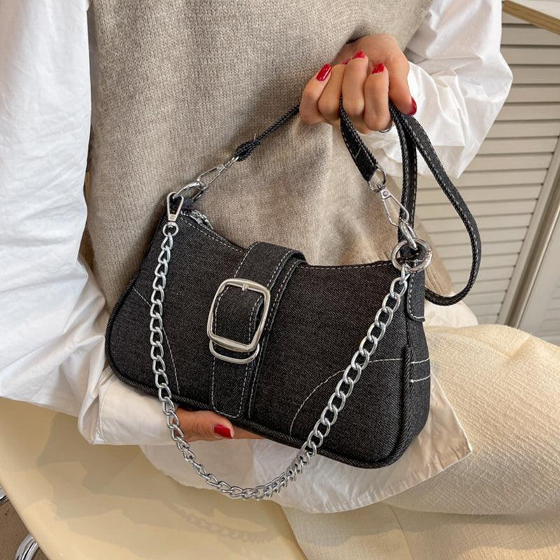 Elegant denim shoulder bag with a stylish chain strap, perfect for trendy women looking to enhance their fashion statement.