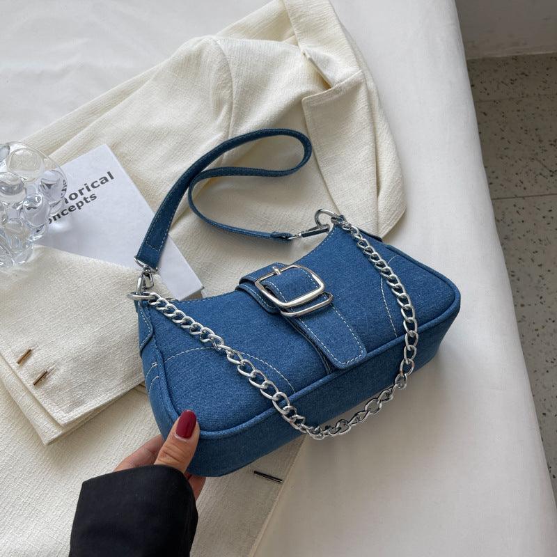 Elegant denim shoulder bag featuring a stylish chain strap, perfect for trendy women.