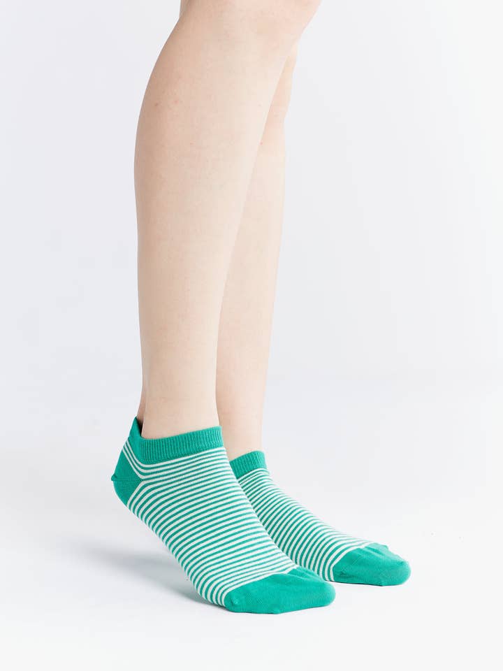 Luxury Organic Cotton Trainer Socks displayed in a lifestyle setting, showcasing their comfort and stylish appeal.
