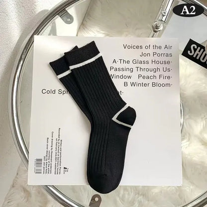 Stylish Women's Tie-Dye Middle Tube Socks in an elegant black colour with white detailing, curated for unmatched comfort and an eye-catching aesthetic.