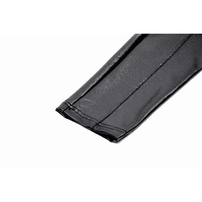 Side view of Dark in Love's Isadora Faux Leather Spliced Leggings, capturing the edgy thigh panel design and flattering silhouette.