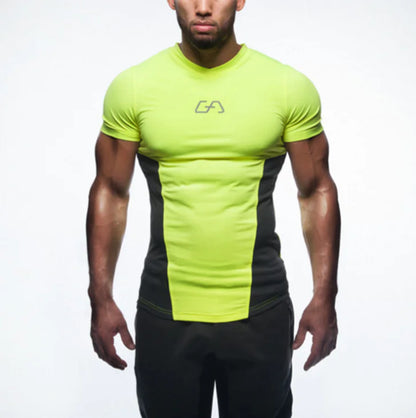 Stylish men's quick-dry compression T-shirt in luminous green with black detailing, designed for a sophisticated athletic look during training.