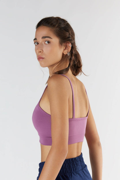 Model wearing a luxury Tencel bra top, emphasising the form-fitting silhouette and versatility for activewear or everyday styling.