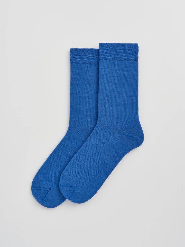 Luxurious Merino wool socks folded neatly to reveal their soft texture and quality materials, perfect for comfort and style.