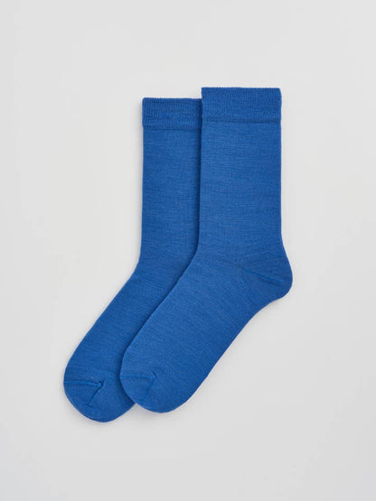 Luxurious Merino wool socks folded neatly to reveal their soft texture and quality materials, perfect for comfort and style.