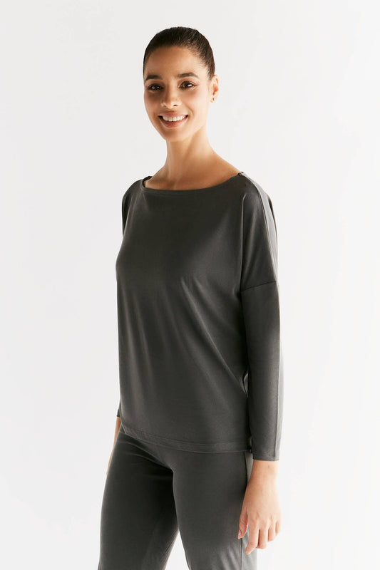 Luxurious Women's Eco-Friendly Tencel Long Sleeve Yoga Shirt, designed for comfort with moisture-regulating fabric, featuring 79% modal and 21% recycled polyester.