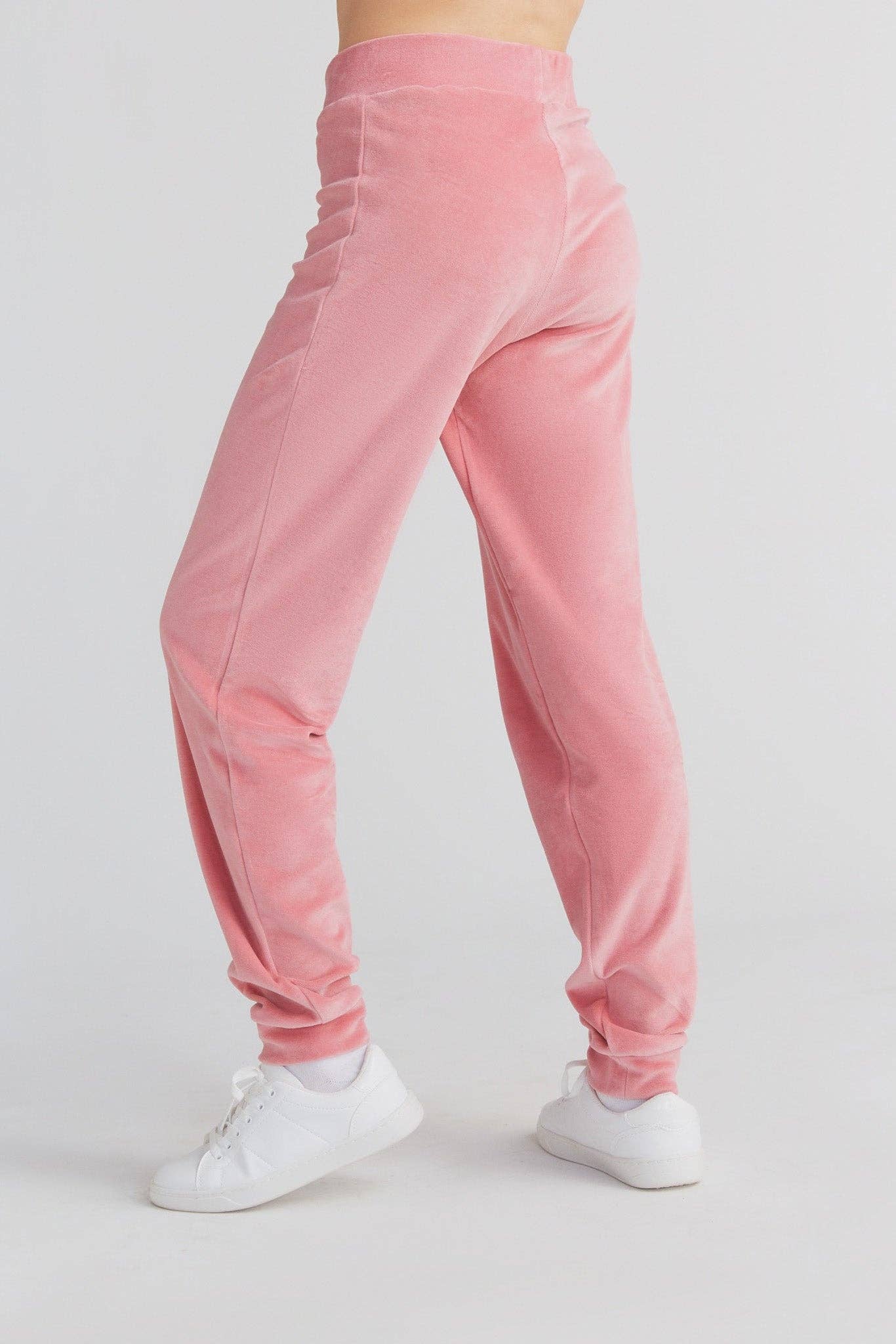 Elegant lifestyle shot of women wearing organic cotton tapered sweatpants, exemplifying comfort and luxury in casual fashion.