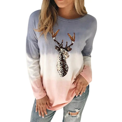 Luxurious women's reindeer sweater featuring a gradient design in soft pastel hues, adorned with a shimmering sequin deer motif, ideal for festive occasions.