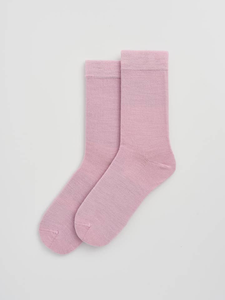Stylish Merino calf-length socks displayed in a chic setting, perfect for luxurious everyday wear.