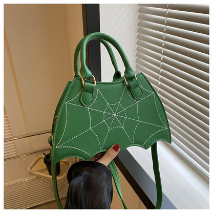 Halloween Spider Web Saddle Bag in vibrant green, featuring a unique spider web motif, ideal for making a fashionable statement during Halloween festivities.