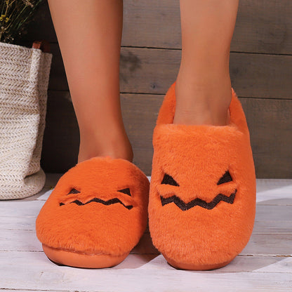 Cute Halloween Pumpkin Slippers featuring a charming design with a playful jack-o'-lantern face, showcasing warmth and luxury for a cozy autumn. Perfect for indoor lounging or Halloween festivities.