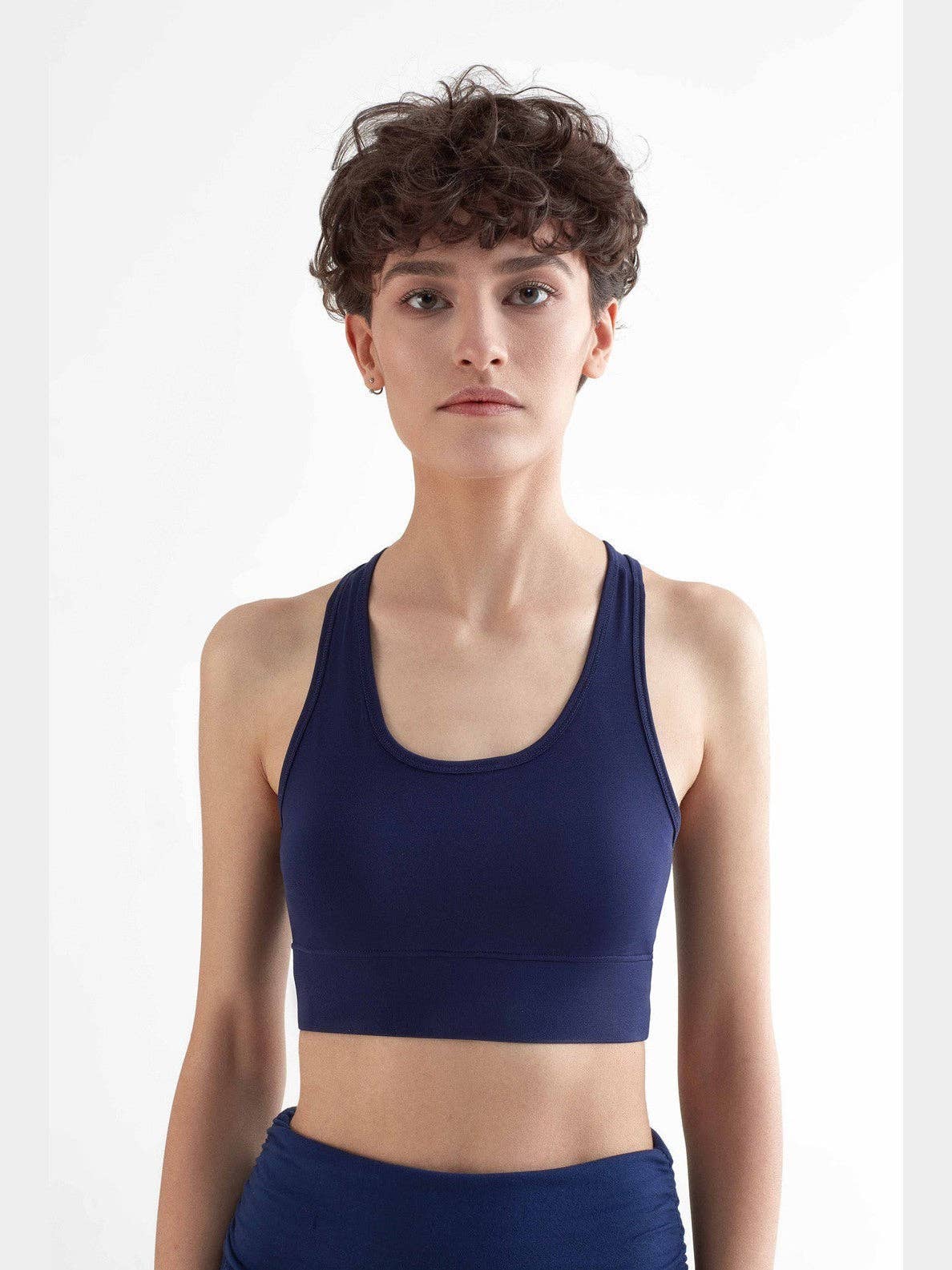 Luxurious eco-friendly women's sports bra made from 94% recycled polyester and elastane, designed for comfort and style.