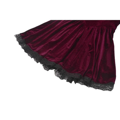 Elegant close-up of the lace collar and sheer yoke detailing on a stylish burgundy velvet dress, showcasing vintage goth aesthetics.