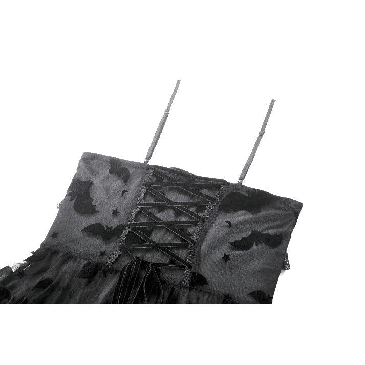 Stylish model showcasing the ruffled skirt and cut-out panel design of the Morwenna Bat Mesh dress.