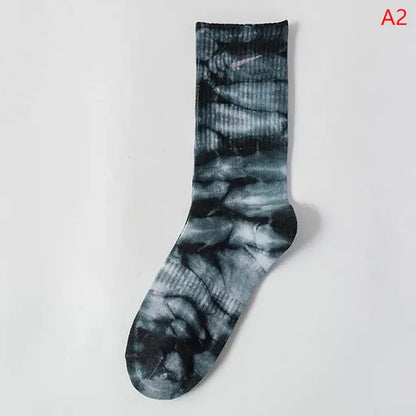Chic black and grey tie-dye middle tube socks, designed for stylish comfort and vibrant self-expression.