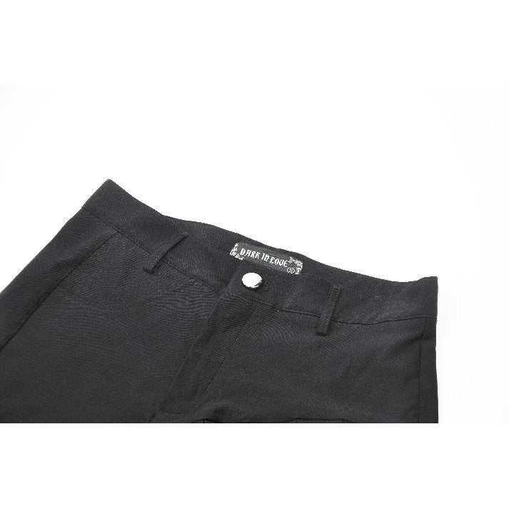 Detailed view of the Dark in Love Gwen pleated garter shorts showcasing the distinctive asymmetrical hem and detachable garter strap, epitomising punk-inspired elegance.