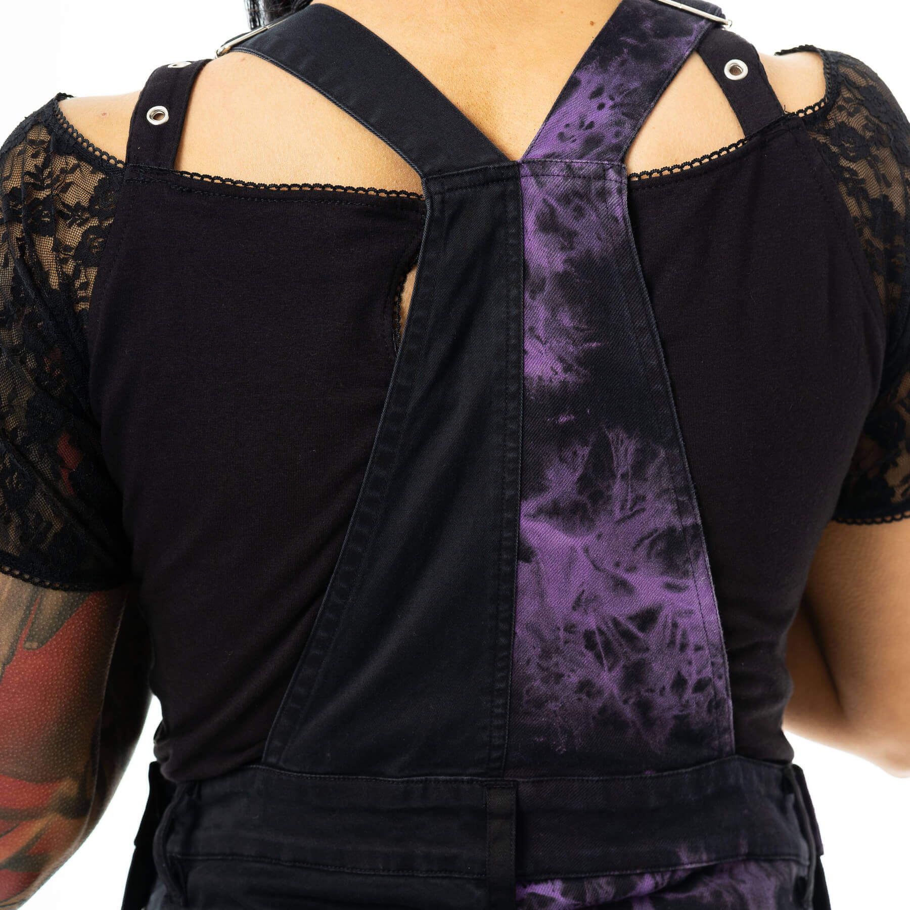 Flat lay of Vixxsin Ever Dungarees in black and purple tie-dye, crafted from premium fabric for ultimate comfort and style.