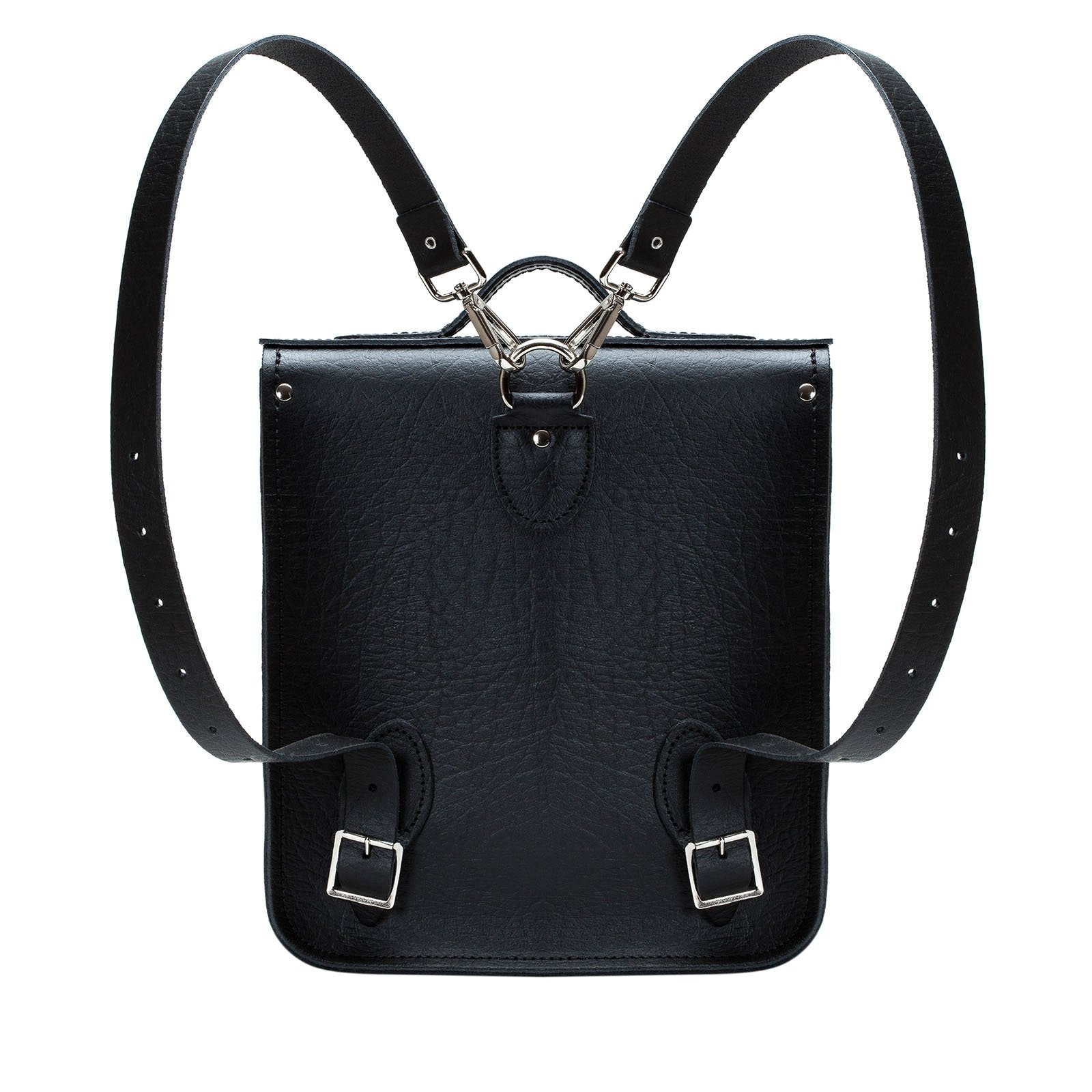 Versatile Luxury Handmade Black Leather City Backpack in a stylish setting, highlighting adjustable and detachable straps for personalised comfort