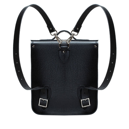 Versatile Luxury Handmade Black Leather City Backpack in a stylish setting, highlighting adjustable and detachable straps for personalised comfort