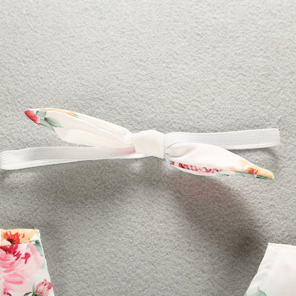 Close-up of the delicately tied headband that complements the Luxurious 100% Cotton Floral Romper for Baby Girls, enhancing the summer style.