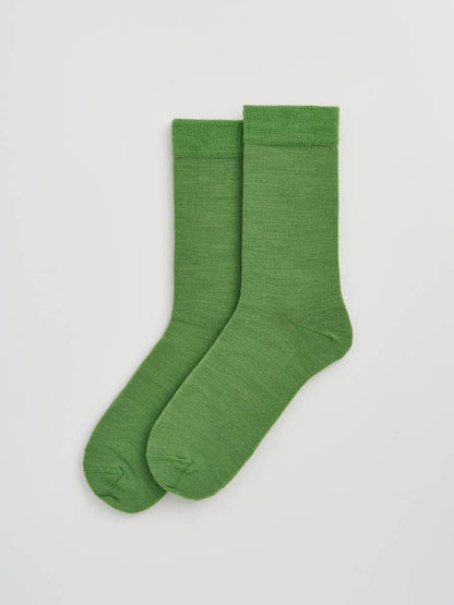 Luxurious Merino wool calf-length socks in a smooth texture, showcasing their elegant design and odour-resistant properties.