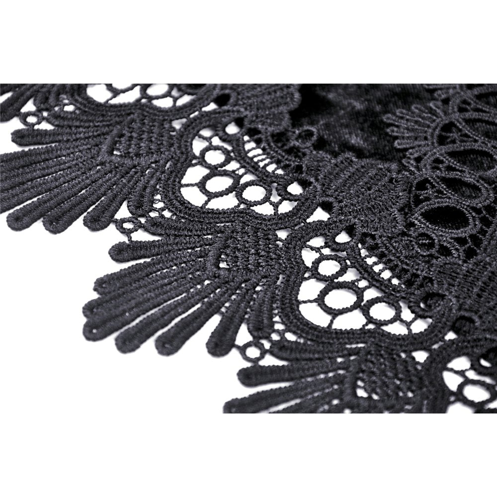 Asymmetrical hemline of the Melisandre velvet mesh skirt highlighted against a dramatic backdrop, emphasising its romantic gothic style.