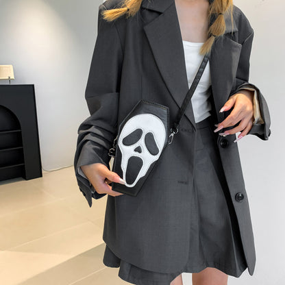 Fashion-forward Halloween Coffin-shape Shoulder Bag with a dramatic ghost design, worn stylishly by a model in a tailored grey ensemble.