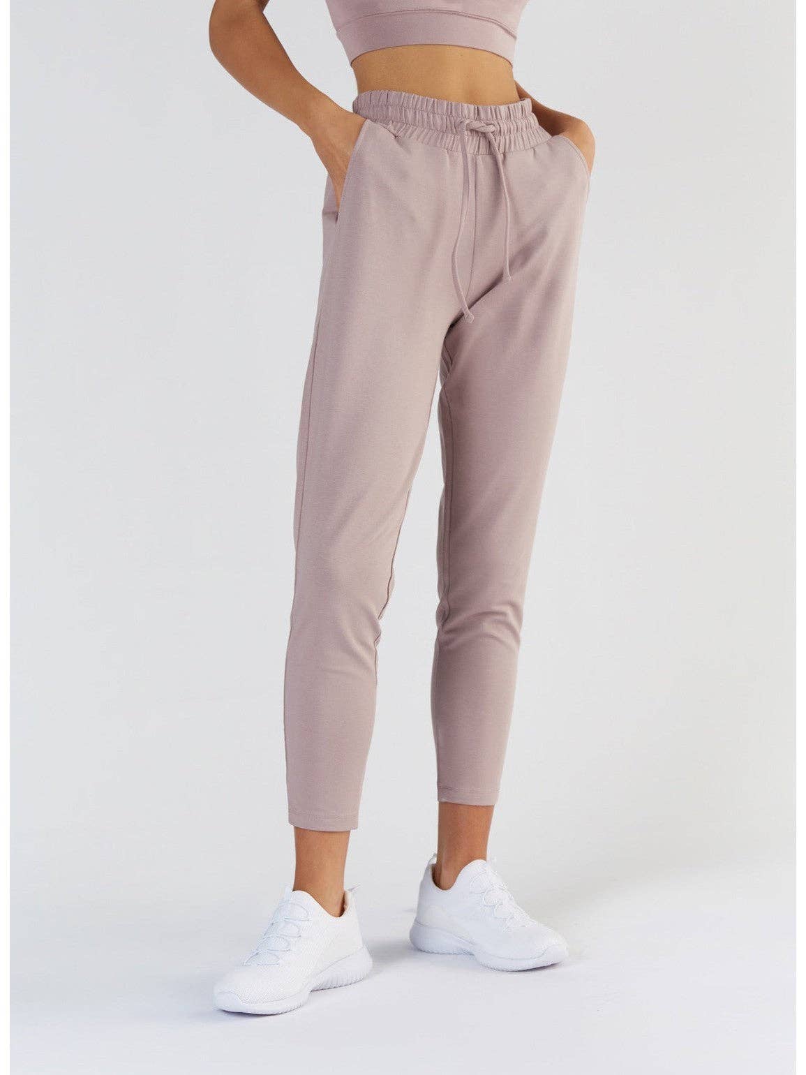 Graceful model wearing relaxed-fit Tencel sweatpants, epitomising casual luxury and modern style.