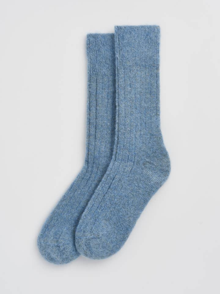 Close-up of luxurious alpaca bed socks showing the fine ribbed texture and soft fabric for warmth and comfort.